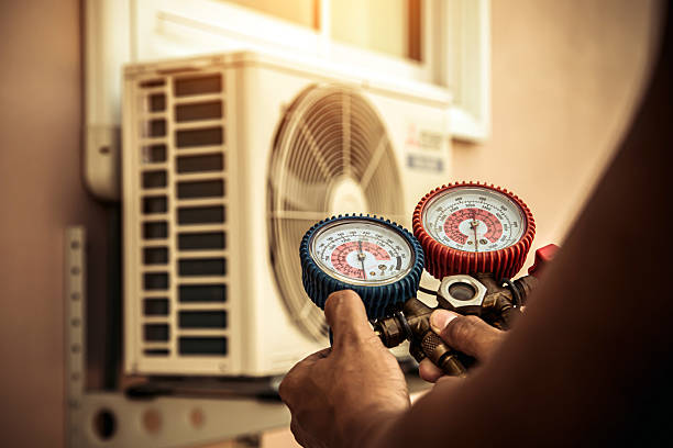Professional Heat Pump Repair technician working in Hanson, MA